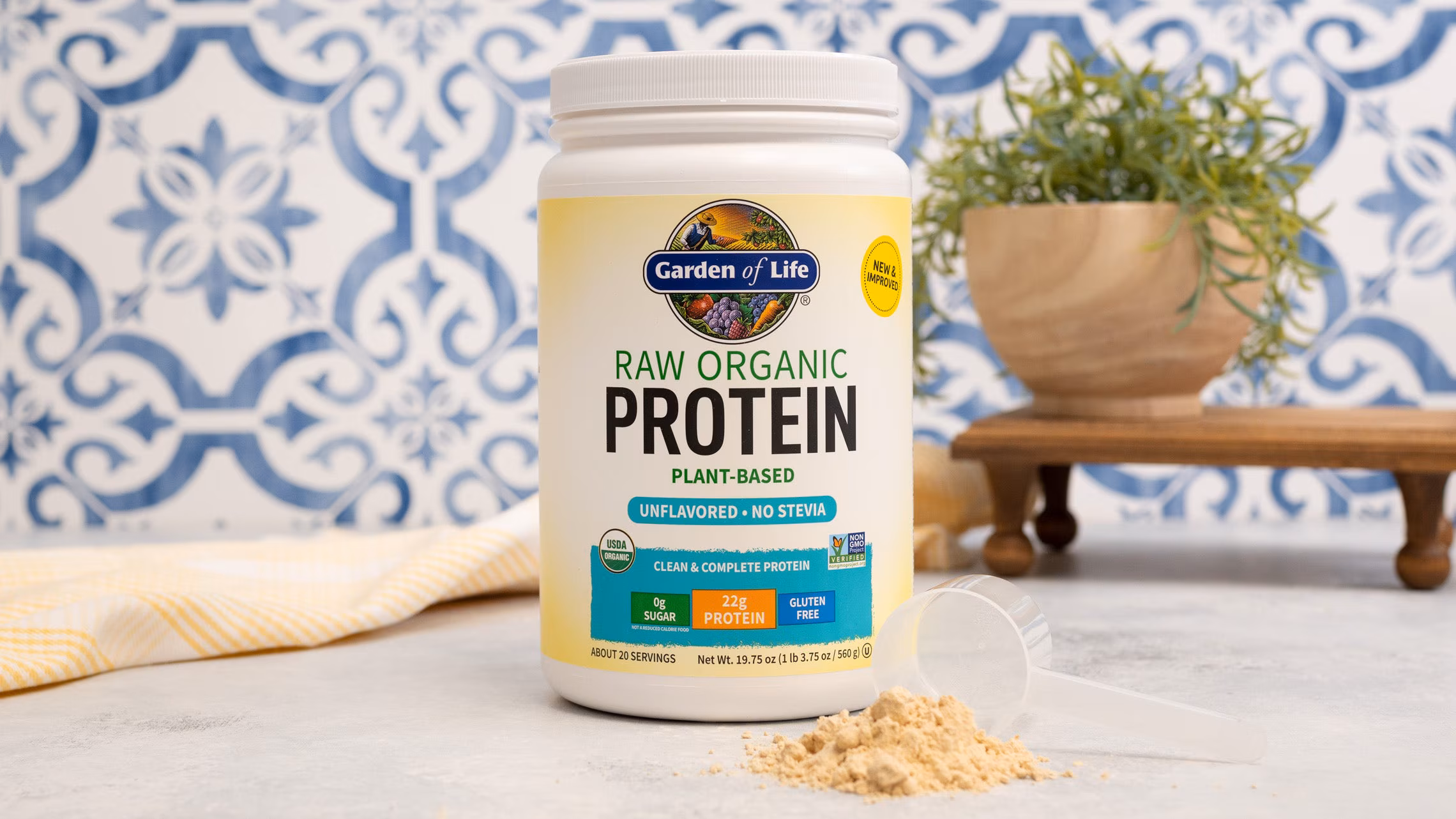 Jar of Garden of Life protein powder on a table.